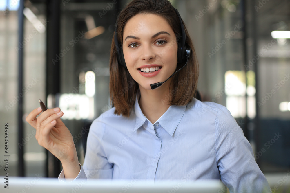 Woman customer support operator with headset and smiling. Woman customer support operator with headset and smiling.