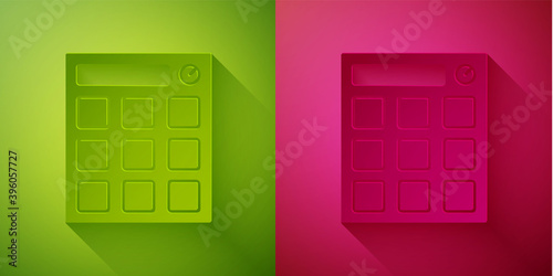 Paper cut Drum machine music producer equipment icon isolated on green and pink background. Paper art style. Vector.