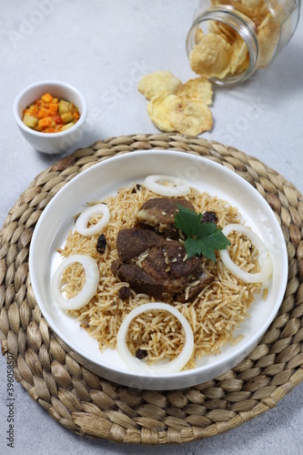 Nasi Kebuli. Kebuli Rice is an Indonesian variant of pilaf. Kebuli rice was influenced by Arab culture and its origin can be traced to Middle eastern cuisine.