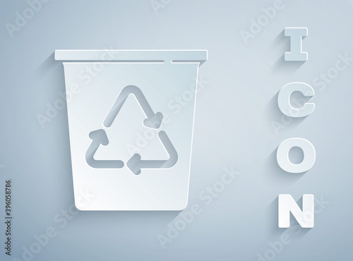 Paper cut Recycle bin with recycle symbol icon isolated on grey background. Trash can icon. Garbage bin sign. Recycle basket sign. Paper art style. Vector.