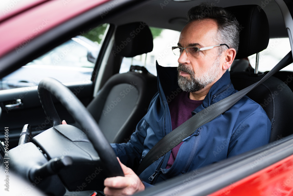 Senior Man Holding Steering Wheel