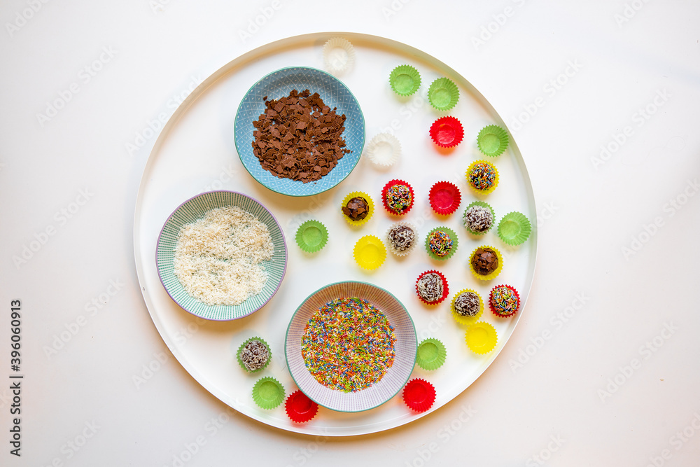 Traditional Austrian Christmas Truffles with Chocolate and Rum. Coated in coconut and sprinkles, handmade from scratch. in pretty colorful paper cups. Traditional Austrian Christmas Truffles with Chocolate and Rum. Coated in coconut and sprinkles, handmade from scratch. in pretty colorful paper cups.
