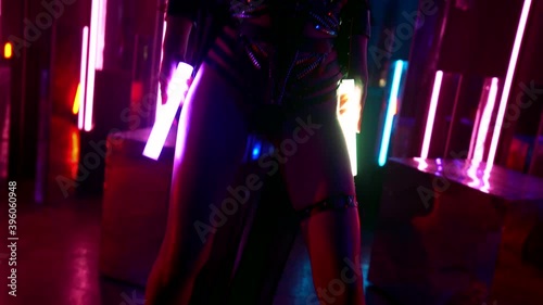 exotic erotic dance of sexy brunette lady, stripper woman is moving in darkness