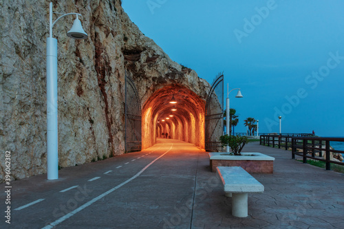 Paseo de los Tuneles del Cantal in the Rincon de la Victoria  Malaga  with the interior of the tunnel illuminated.