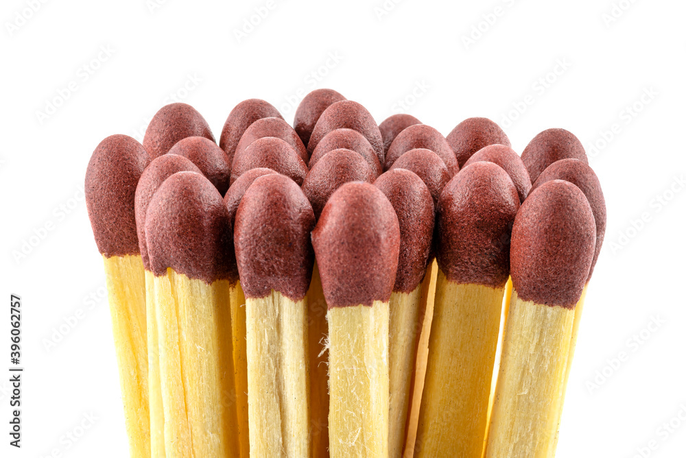 A pile of matches with red heads arranged in a circle, isolated on a white background. A pile of matches with red heads arranged in a circle, isolated on a white background.