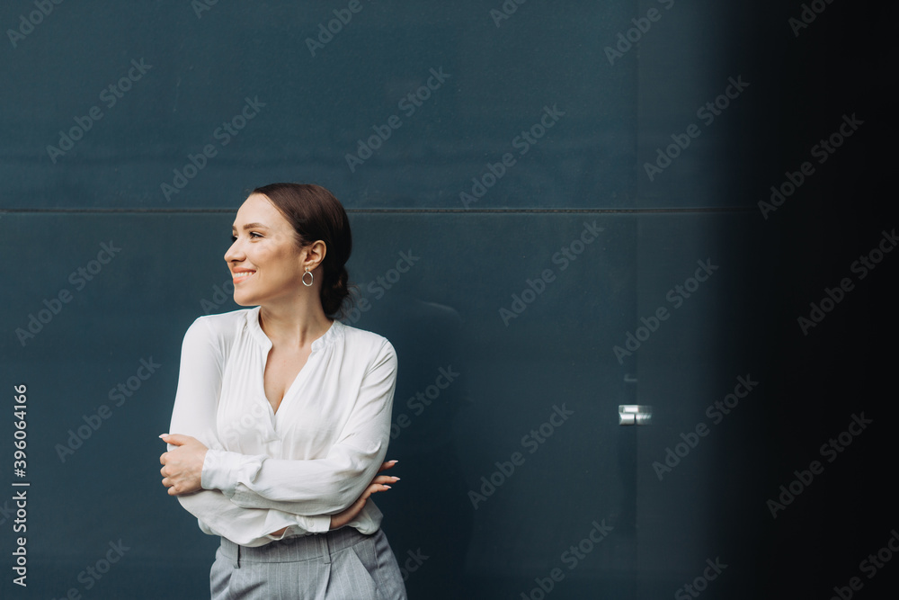 Portrait of happy business woman standing on street. Portrait of happy business woman standing on street.