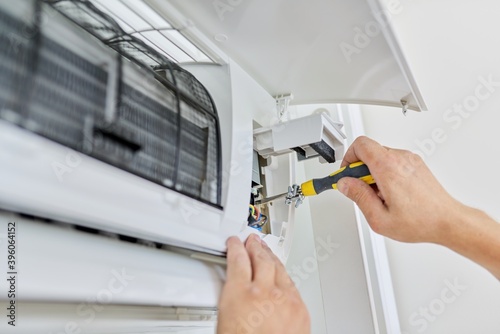 Konstfotografi Installing an air conditioner in an apartment office, close-up of an engineer ha