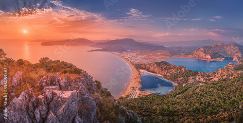 Fototapeta Naklejka Na Ścianę i Meble -  Majestic panoramic sunset view from top of the mountain to the blue sea and lakes near the town of Dalyan in Turkey. Famous Mediterranean resorts and the wonders of nature concept