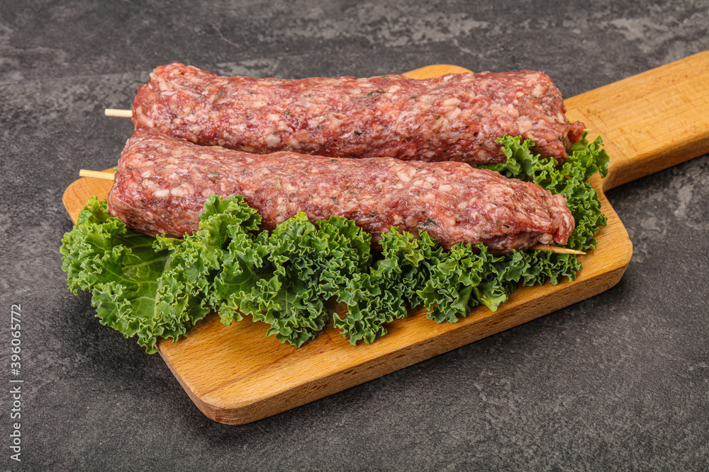 Raw minced beef kebab skewer