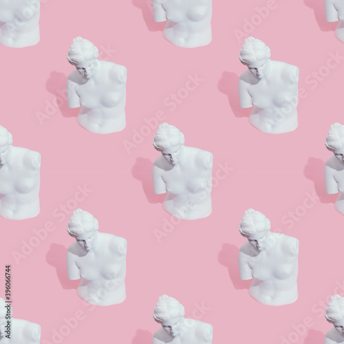 White woman statue on pink background
