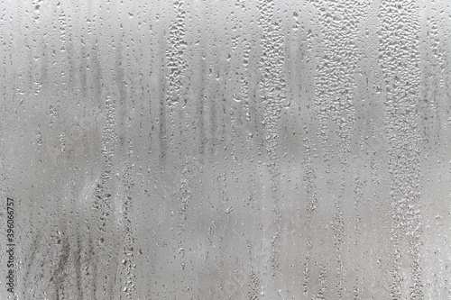Dripping Condensation, Water Drops Background Rain drop Condensation Texture. Close up for misted glass with droplets of water draining down