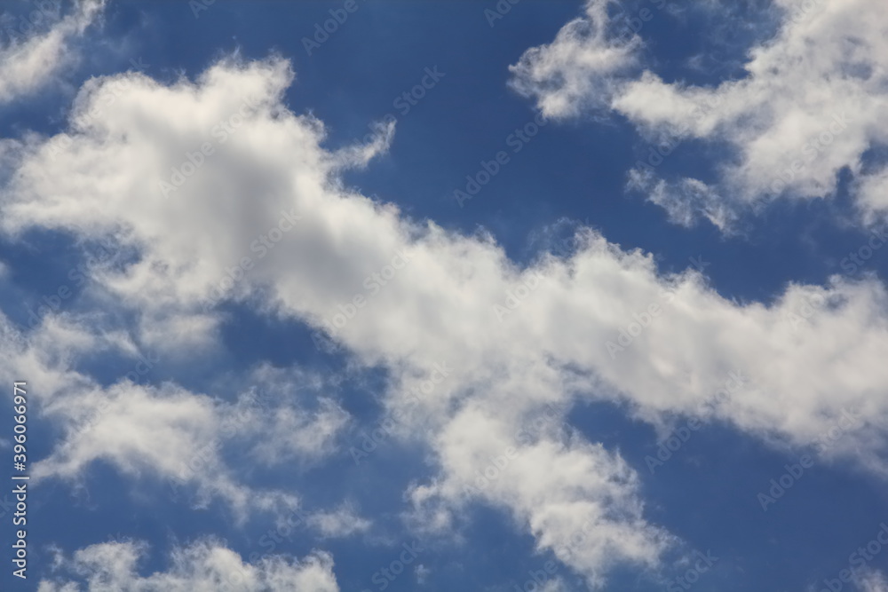 A beautiful and picturesque picture of clouds and blue sky created by nature. A wonderful summer scene that will change fabulously in a few moments. A beautiful and picturesque picture of clouds and blue sky created by nature. A wonderful summer scene that will change fabulously in a few moments.