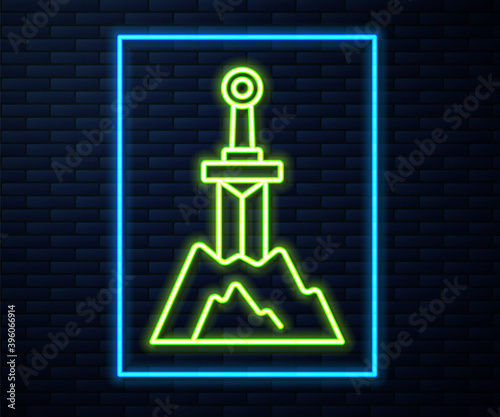Glowing neon line Sword in the stone icon isolated on brick wall background. Excalibur the sword in the stone from the Arthurian legends. Vector.