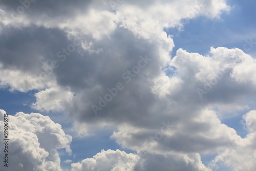 A picturesque picture in which the swift movement of clouds froze against a blue sky