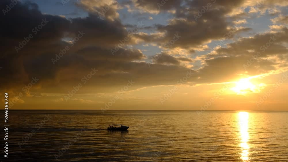 Colorful sunset above the sea surface with sail boats. Colorful sunset above the sea surface with sail boats.