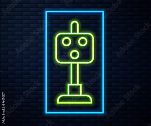Glowing neon line Train traffic light icon isolated on brick wall background. Traffic lights for the railway to regulate the movement of trains. Vector.