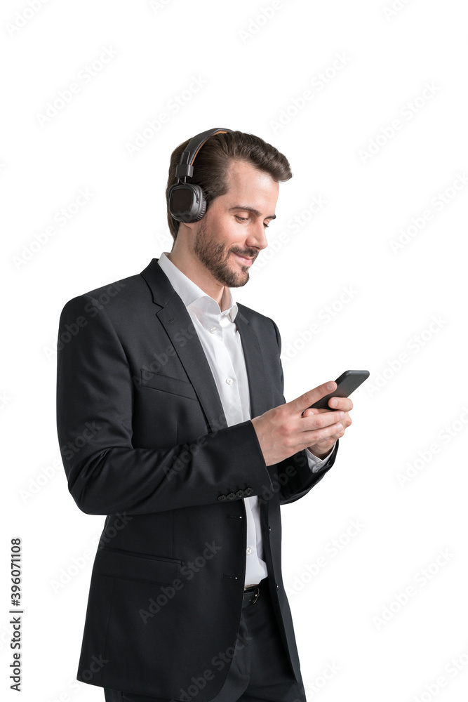 Smiling businessman using smartphone and headphones, isolated Smiling businessman using smartphone and headphones, isolated