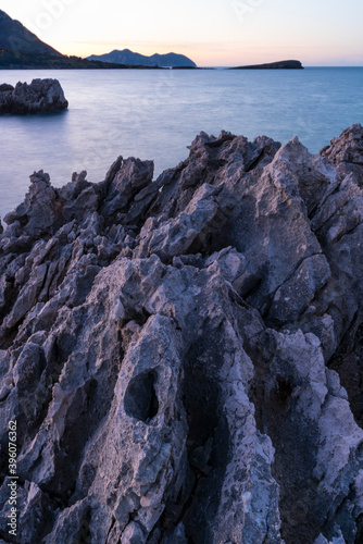 Karst in Islares, in the background Candina and Mount Buciero. Islares, Cantabrian Sea, Castro Urdiales Municipality, Cantabria, Spain, Europe photo