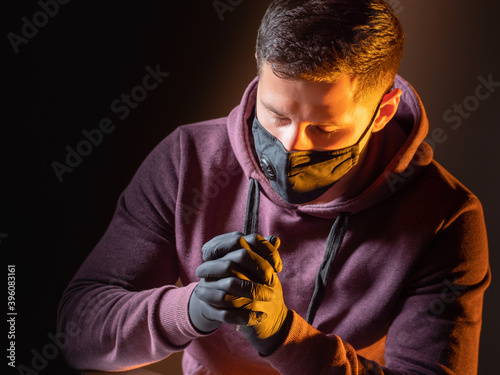Man in medical mask and glo...