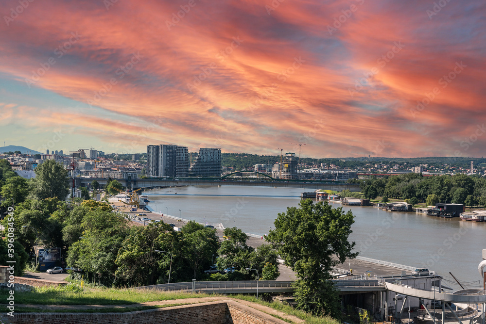 Naklejka premium View at Serbian capital city Belgrade with Sava river bridges and beautiful sundown in the evening from Kalemegdan fortress