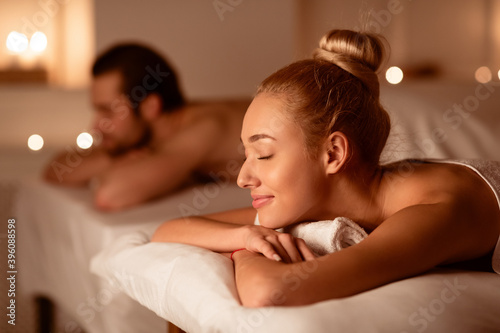 Spouses Resting After Relaxing Massage Therapy Lying In Spa