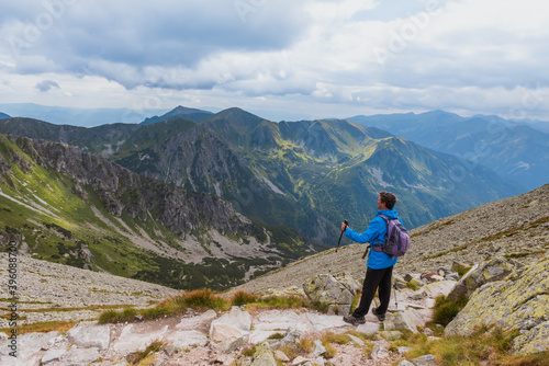 Sporty hiker near summer spring in Tatra Mountains national park, Zakopane, Poland