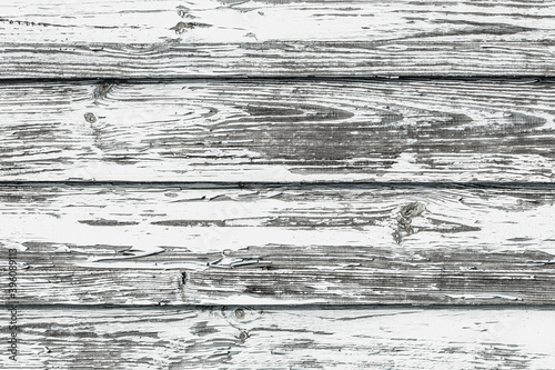 Peeling paint texture. White wood background. Paint desk texture. Cracked wooden wall pattern. Gray vintage rustic plank. Ancient wooden board.