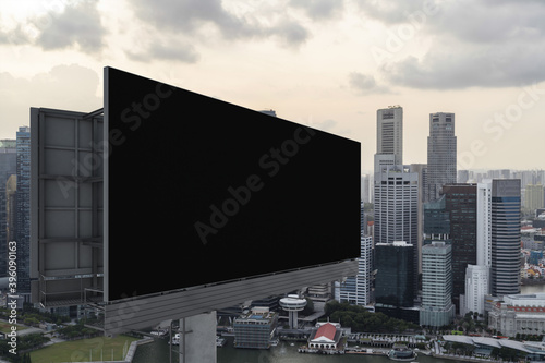 Blank black road billboard with Singapore cityscape background at sunset. Street advertising poster, mock up, 3D rendering. Side view. The concept of marketing communication to sell idea.