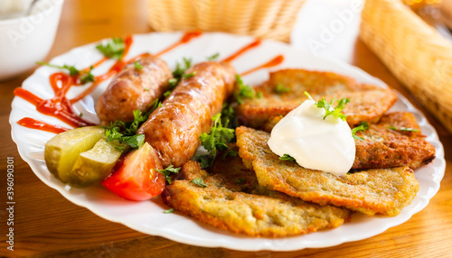 belarusian pancakes with sausages in a restaurant