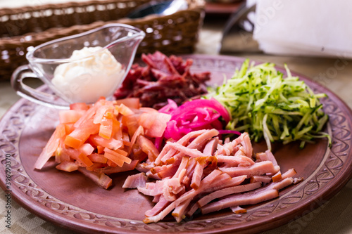 traditional Belarusian salad of vegetables and bacon. salad Paparats kvetka photo