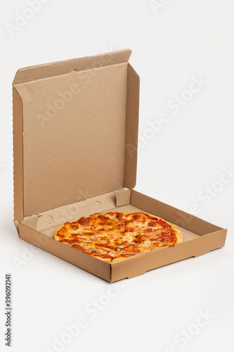 Delivery service, pizza in paper box dilevered to home