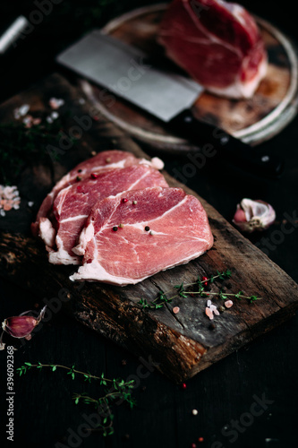 Raw pork steak on a wooden table