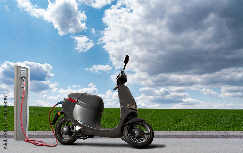 Electric scooter with charging station on a background of green field and  blue sky Stock-Foto | Adobe Stock