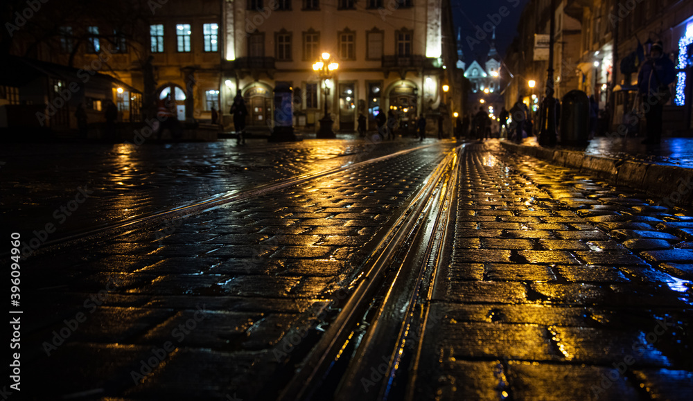 Lviv, Ukraine - November 28, 2020: Lviv Market square at night in rain