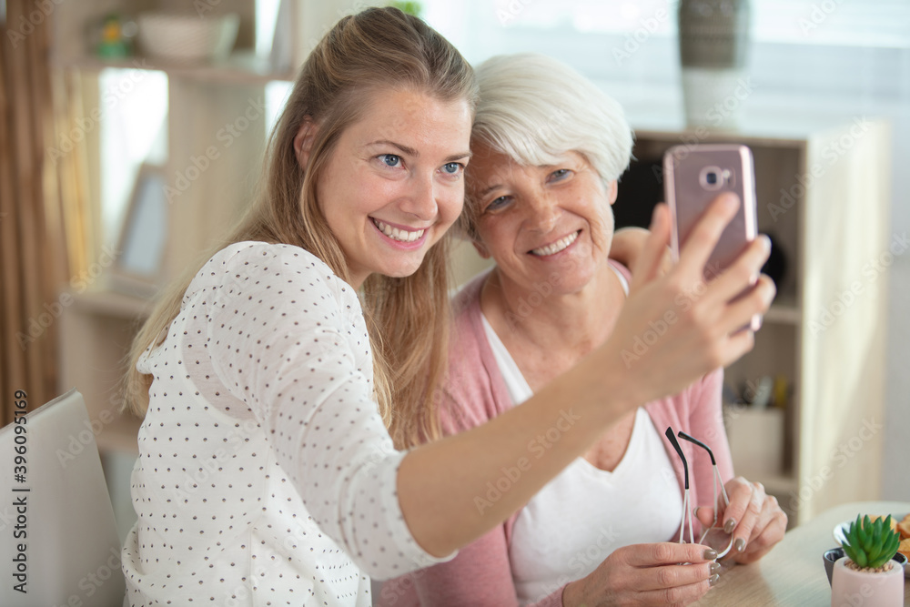 happy daughter is taking photo with parent happy daughter is taking photo with parent