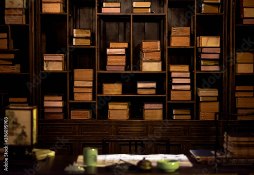 The chinese traditional bookshelf  with the  chinese decoration on the wood table in the old library.