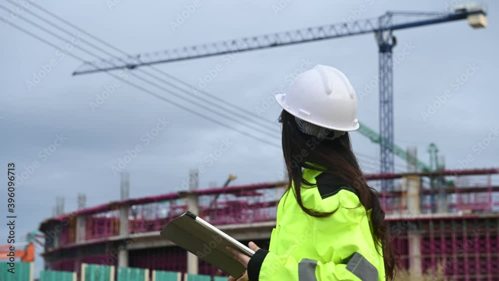 Asian engineer working at site of a large building project,Thailand people,Work overtime at construction site