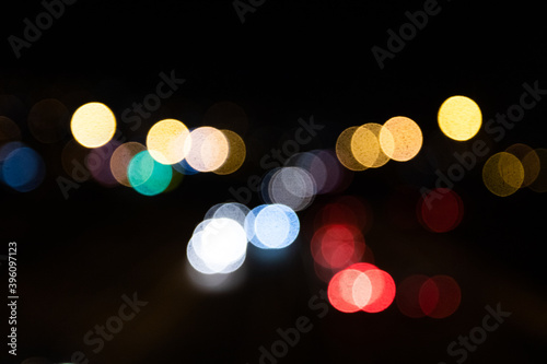 Blurred out of focus colorful lights from the cars on the motorway