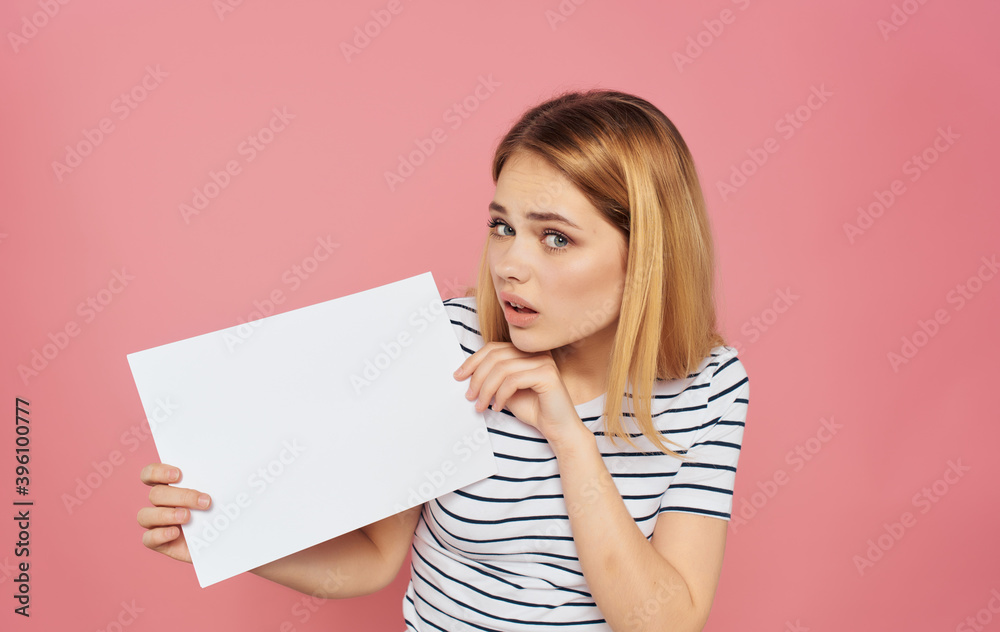 Woman in striped T-shirt emotions Copy Space pink background Woman in striped T-shirt emotions Copy Space pink background
