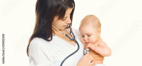 Close up of woman doctor listening to the heart of baby over a white background