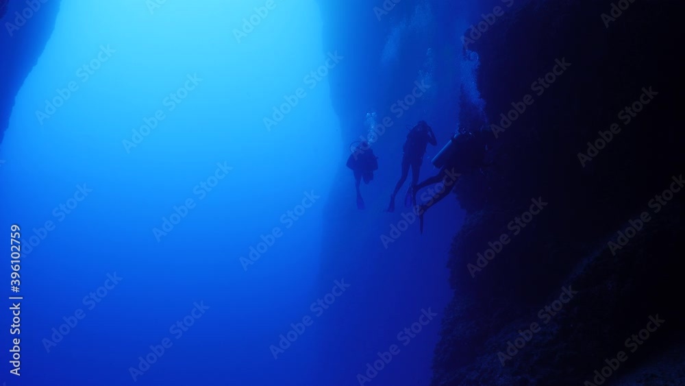 cave diving underwater scuba divers exploring caves and having fun ocean scenery sun beams and rays background cave diving underwater scuba divers exploring caves and having fun ocean scenery sun beams and rays background