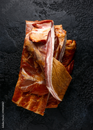 Stripy cured pork side bacon pancetta smoked on wood chip photo