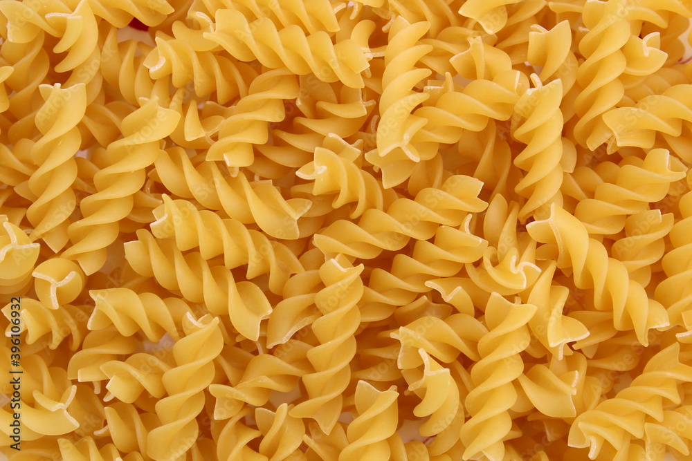 Texture of golden pasta in the form of a spiral for cooking Texture of golden pasta in the form of a spiral for cooking