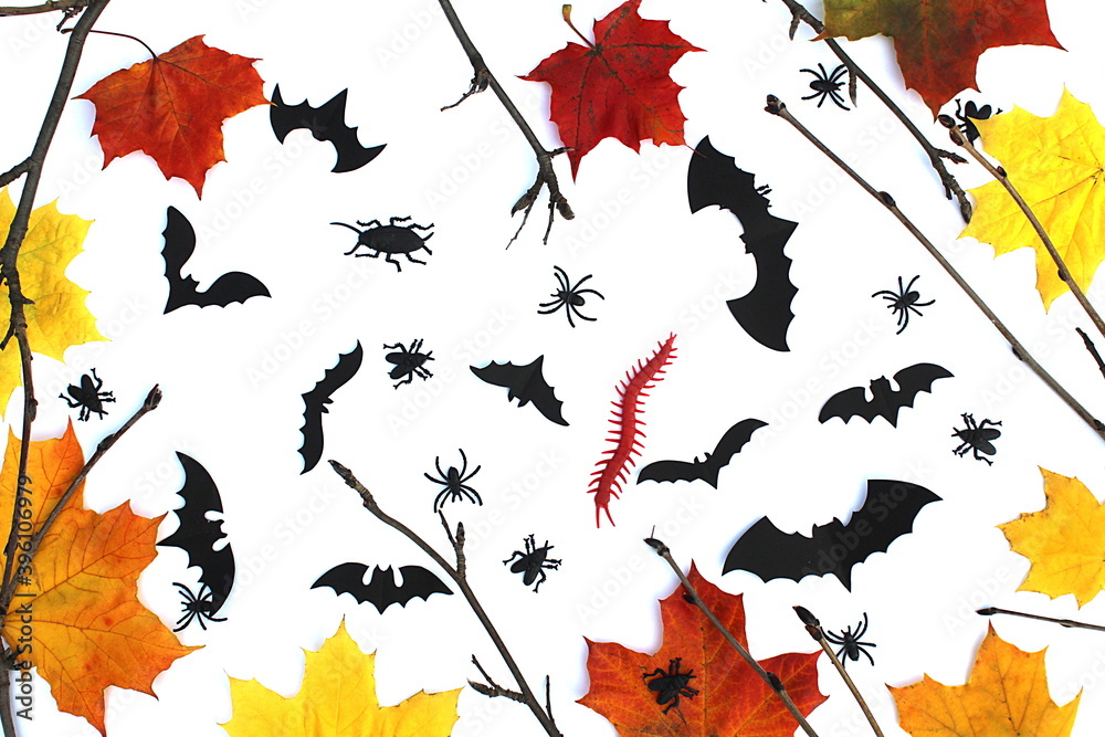 Obraz premium Halloween-themed autumn background with bats leaves and cockroaches