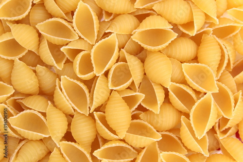 Texture of golden brown shell-shaped paste