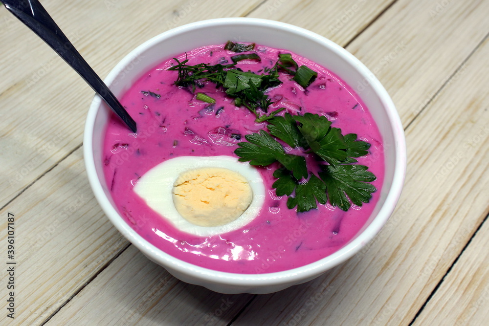 A plate of beetroot soup is on the table A plate of beetroot soup is on the table