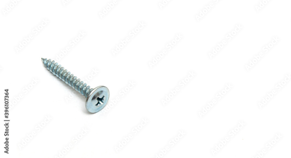 Metal screw on white background are used in construction to connect objects Metal screw on white background are used in construction to connect objects
