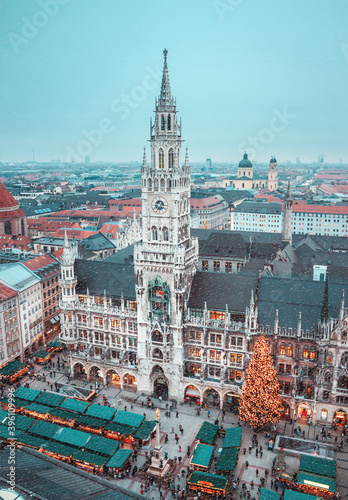Panorama of Munich. View of the central square, town hall, Christmas market. Snowfall in Munich, Germany. Winter city. Festive mood.