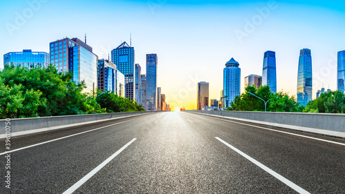 Empty asphalt road and modern cityscape in Beijing at sunset,China. © ABCDstock