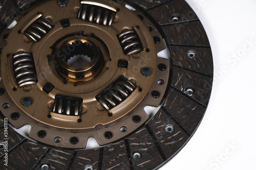 Close-up of a new auto clutch disc. Spare parts for car maintenance and service